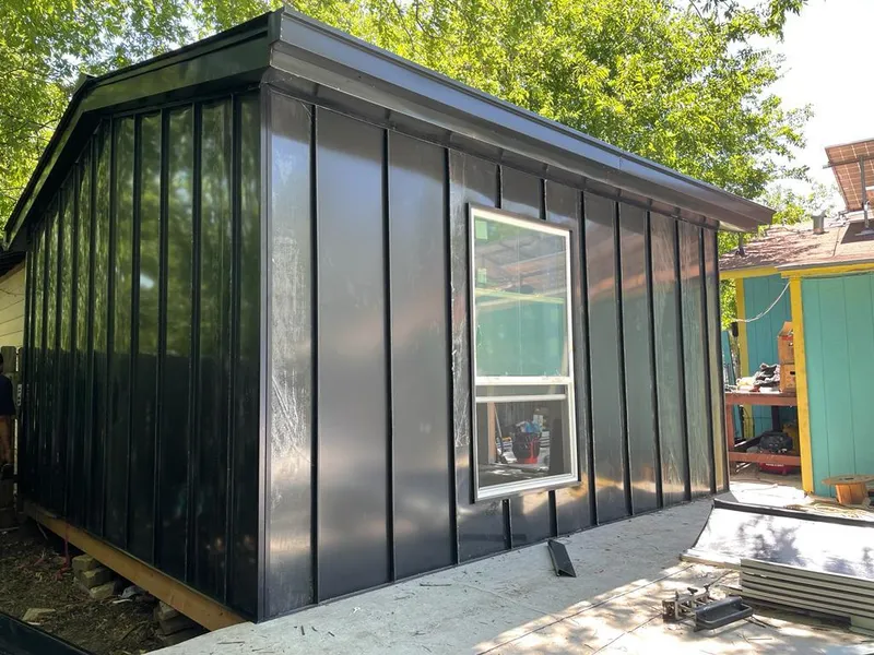 Black standing seam metal wall panels for Roof Inspection in Diboll