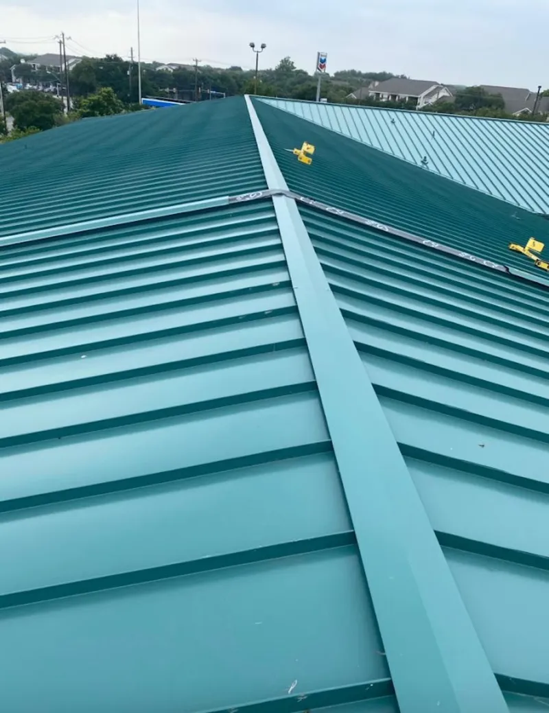 Green commercial metal roof ridge and valley for Metal Roof Repair in Diboll
